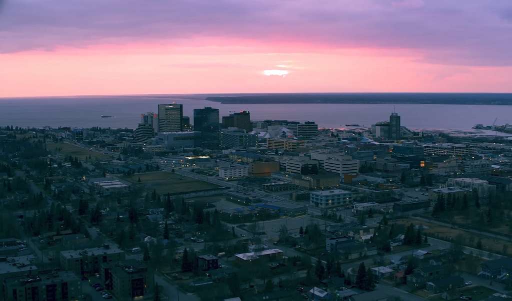 Anchorage skyline at sunset with visible haze and moderate air quality near the harbor