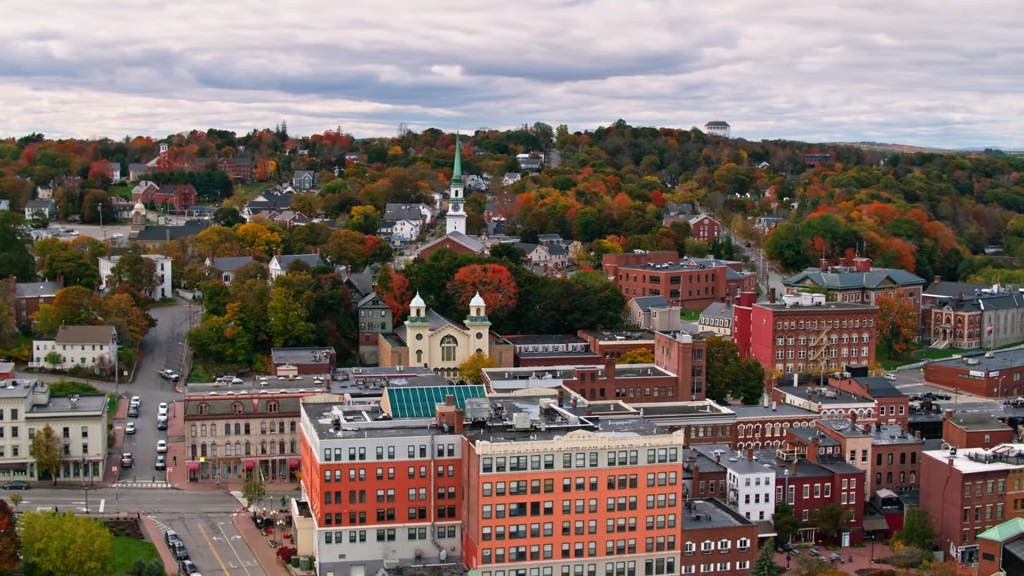 Downtown Bangor during autumn, surrounded by trees and residential housing