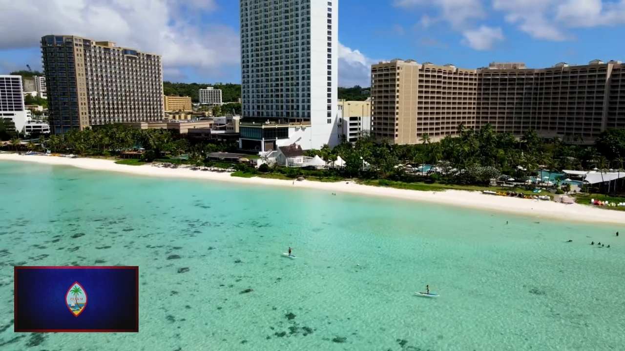 Modern beachfront hotels and turquoise waters in Guam, a major hub among US Territories